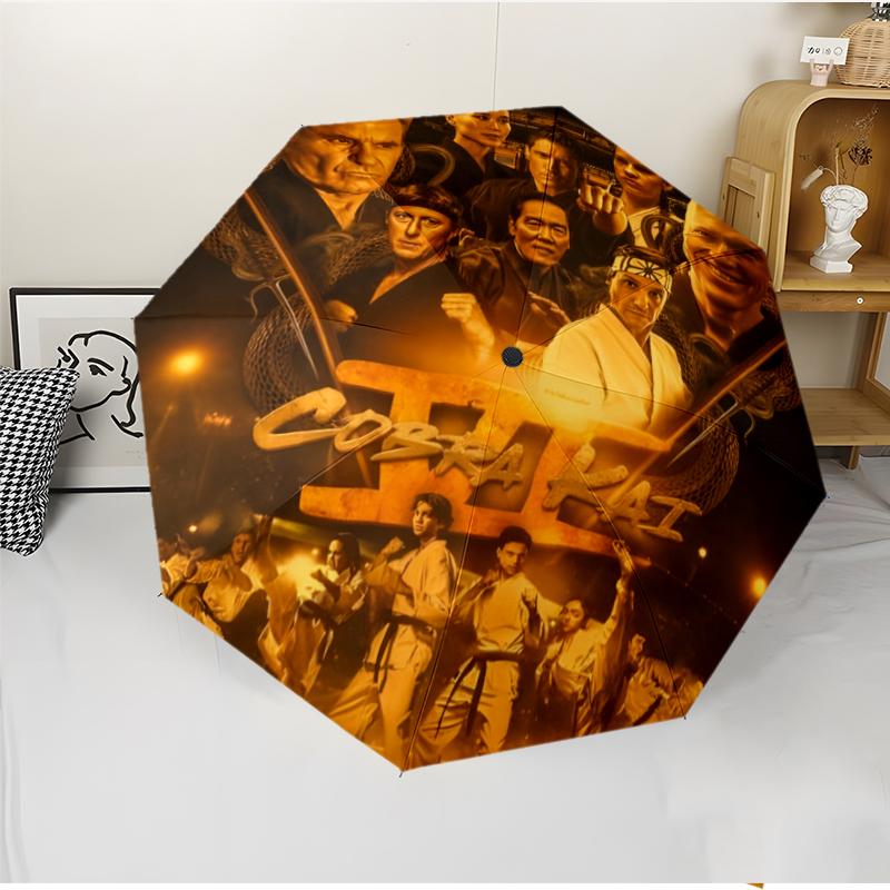 Cobra Kai Fashionable Automatic Opening/Closing Folding Umbrella. Portable and Foldable, Ideal for Gift, Travel, and Daily Use.
