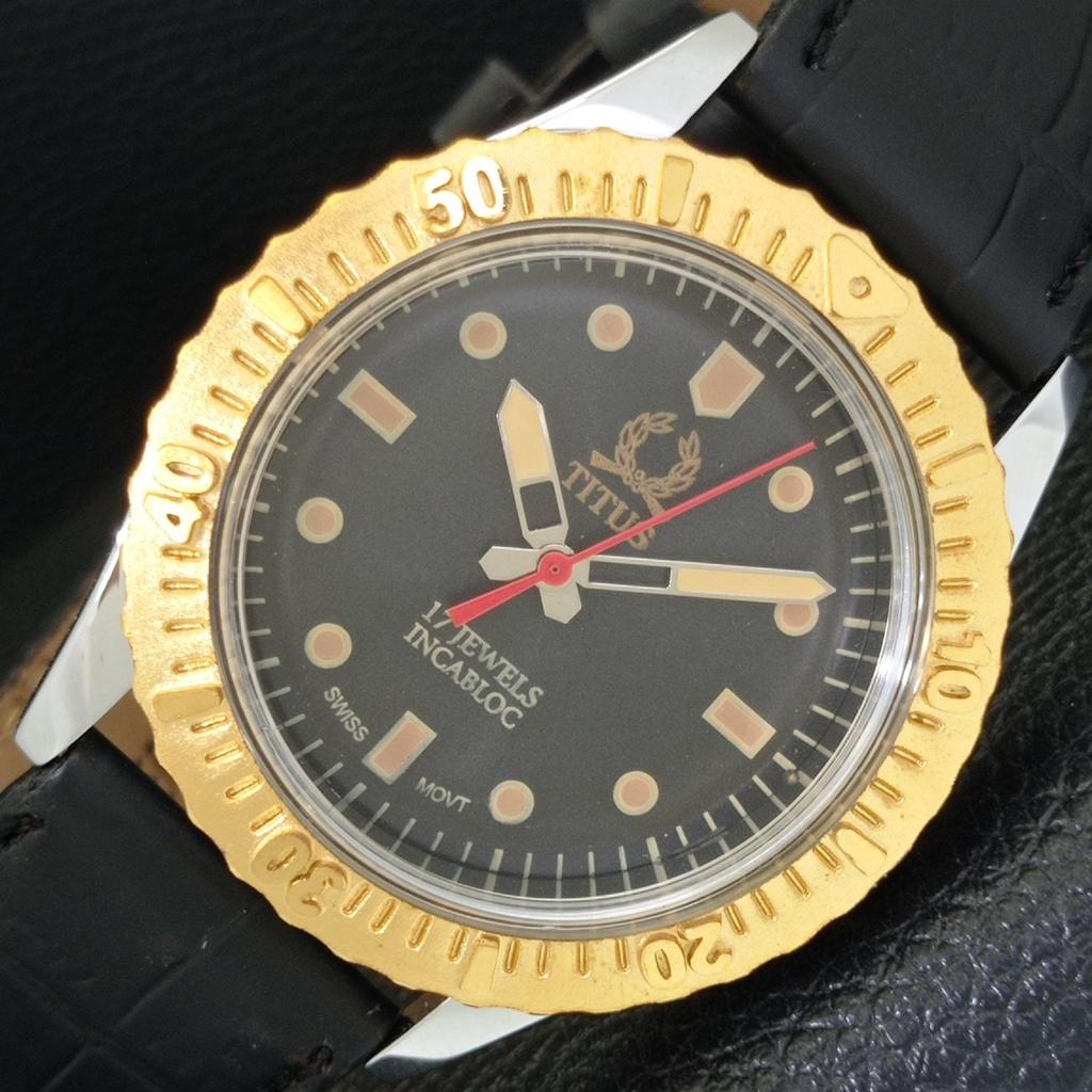 

SWISS MENS VINTAGE TITUS HAND-WINDING TURNABLE BEZEL BLACK DIAL WATCH a700040-5 R201-a700040
