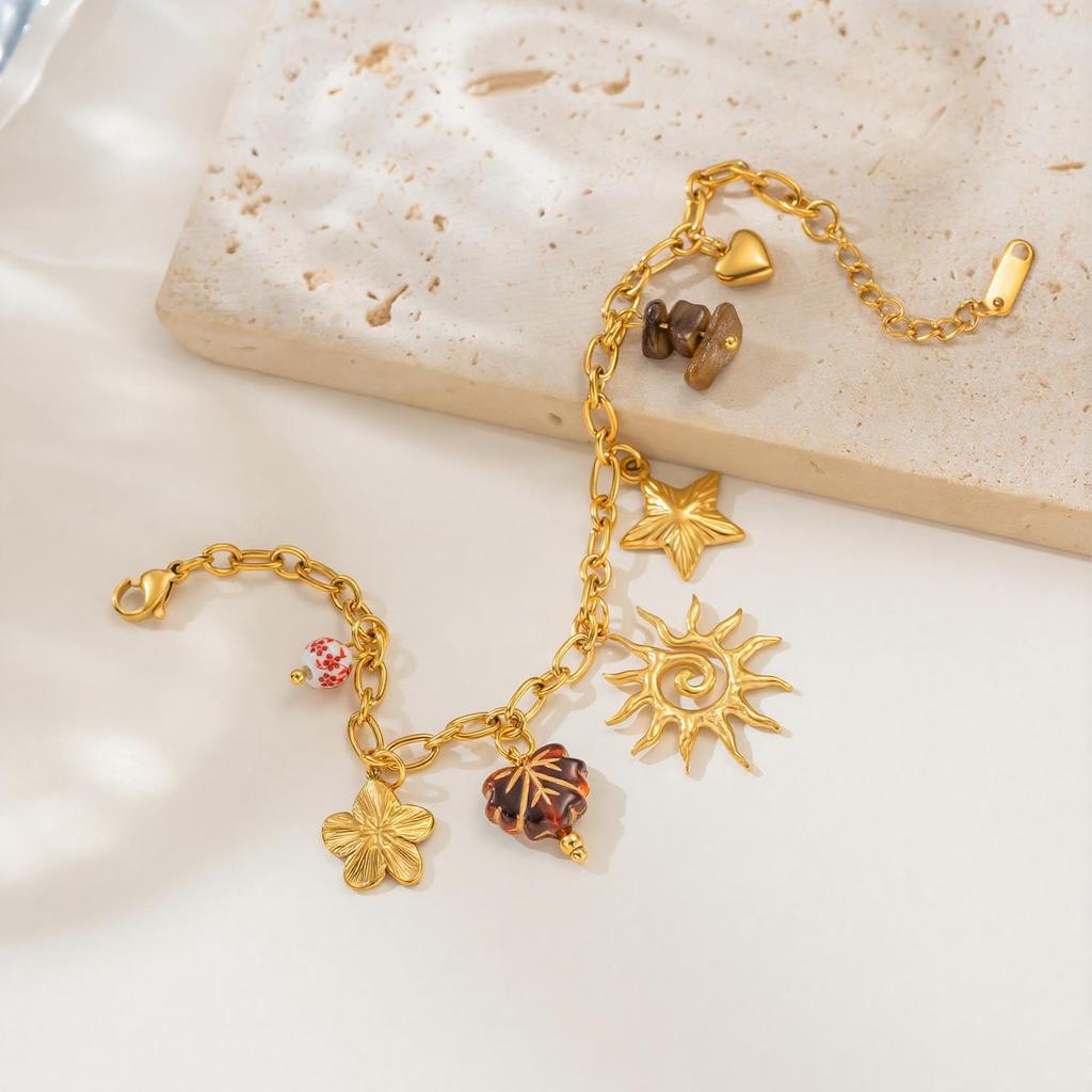 18K Gold Plated Multi-Pendant Bracelet with Sun, Star, Flower, Gravel, and Leaf Charms - Fashionable Stainless Steel Jewelry.