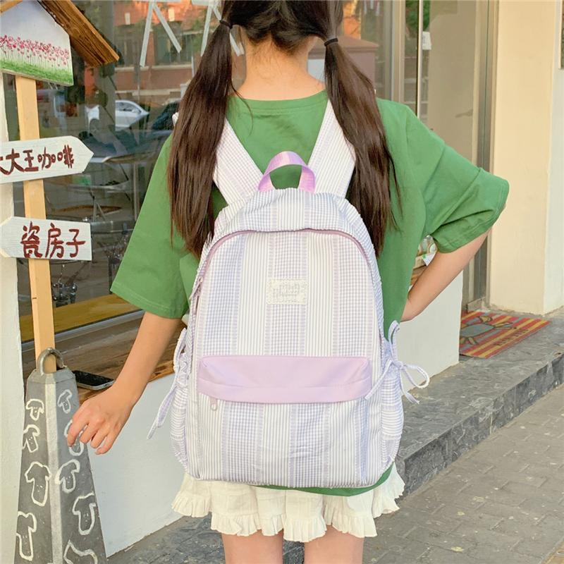 Karomuster Rucksack mit Fronttasche und seitlichen Zugbeuteltaschen