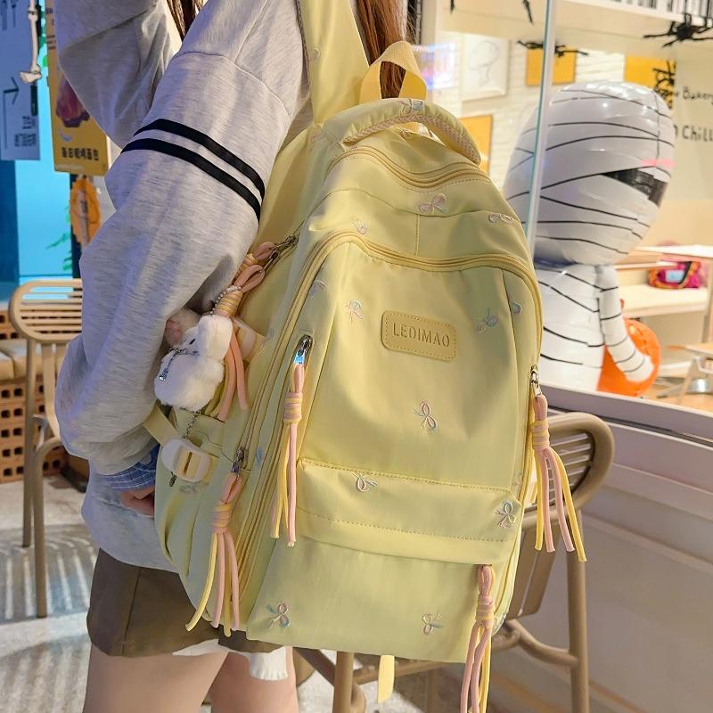New schoolbag female junior high school college student small fresh bow large capacity backpack dopamine backpack