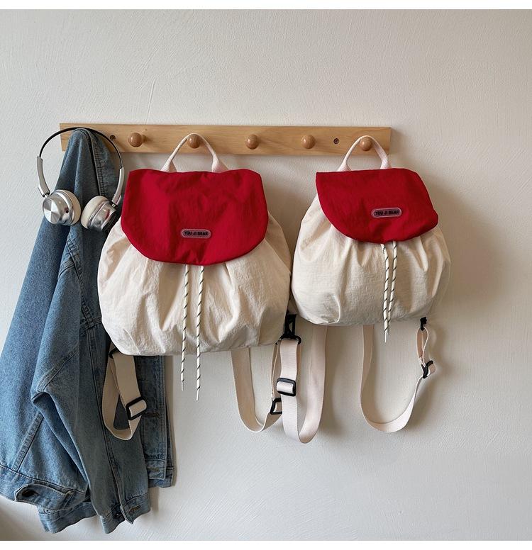 Contrasting color cloth backpack, women's 2025 summer new student commuting lazy style fashion versatile handbag