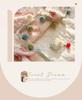 250G Two-Color Cationic Jacquard Throw Blanket with Small Handmade Pom-Poms