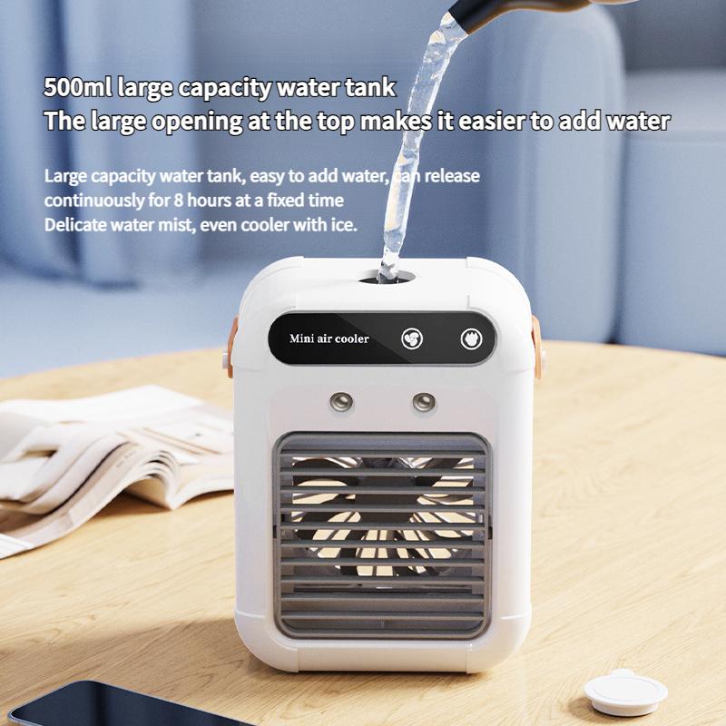 New USB small desktop air cooler mini electric fan with handle two speed adjustable mute spray cooling humidification fan.