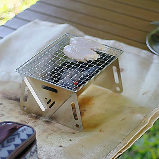 Gril de feu de camp pliant extérieur conception creuse de haute stabilité antirouille résistant à la Corrosion gril de Camping Portable barbecue