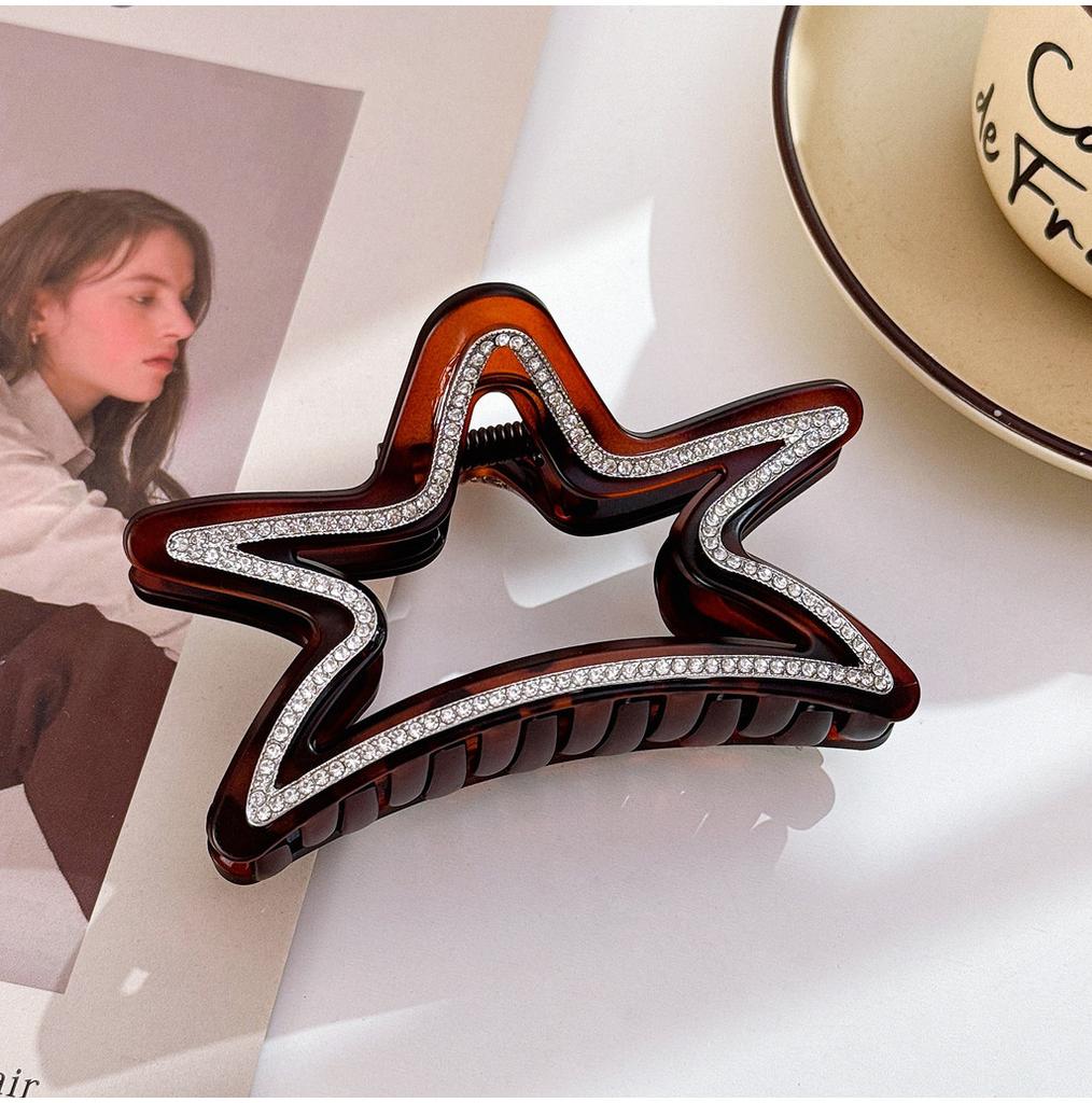 Elegant stjärnformad hårklämma för kvinnor med fantastiska strass i svarta och bruna toner