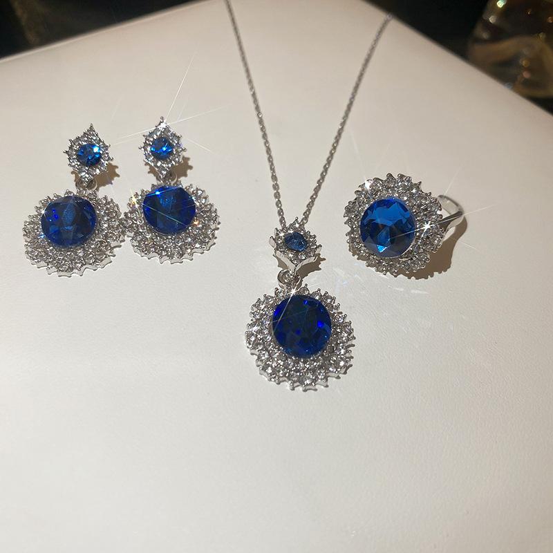 

Diamond-set oval blue gemstone necklace, ring stud earrings, high-end collarbone chain, light luxury necklace.