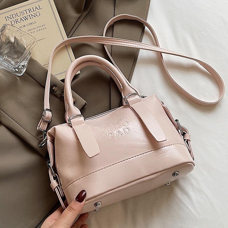 Korean Version of the New High-end College Temperament Portable Pillow Bag Women's Leisure Commuting Versatile Messenger Boston Bag