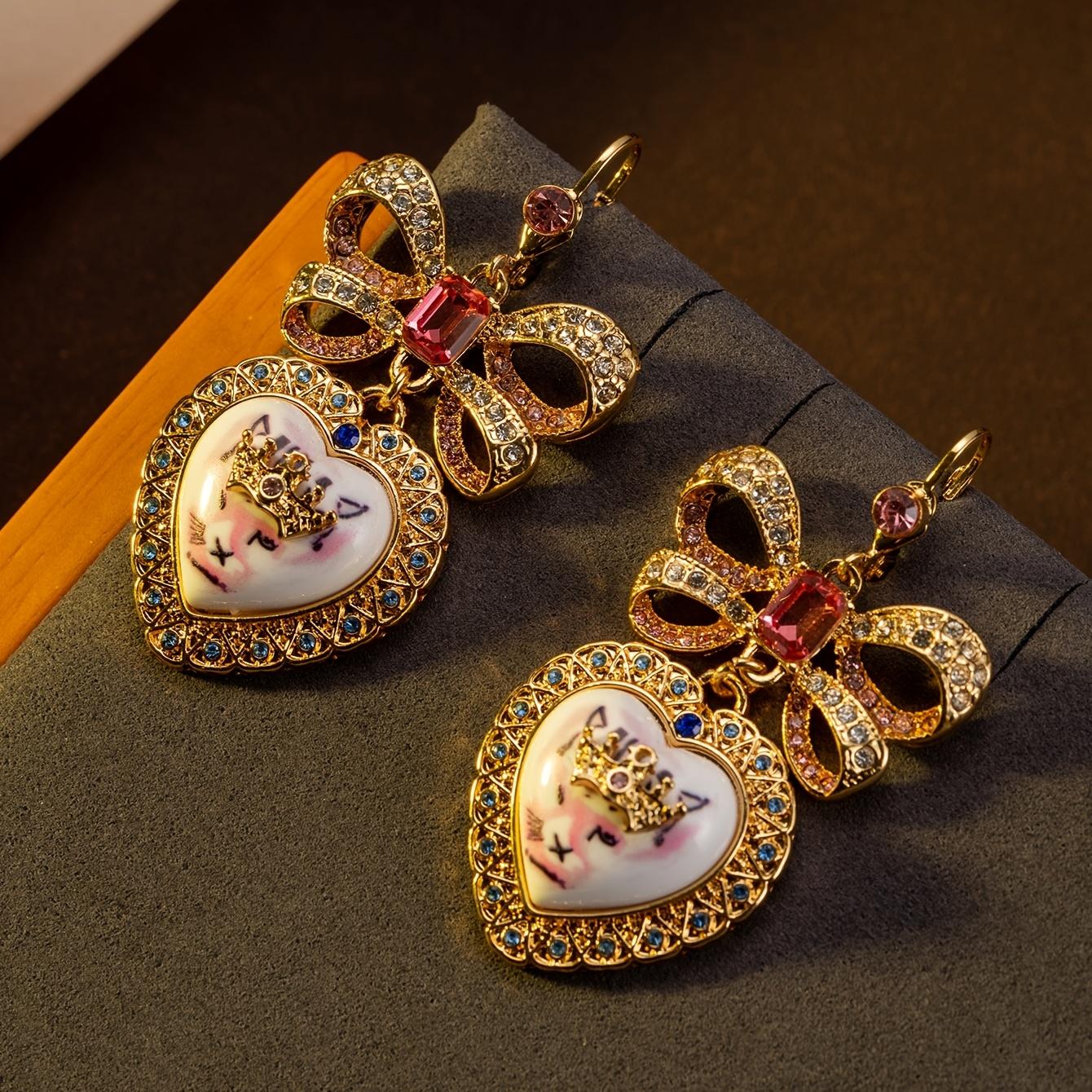 

[Gold Cat Earrings] 24K Gold Plated Pair of Whimsical Cat Crown Dangle Earrings | Golden-Plated Copper Alloy with Heart & Bow Design, Sparkling Red Ge белый