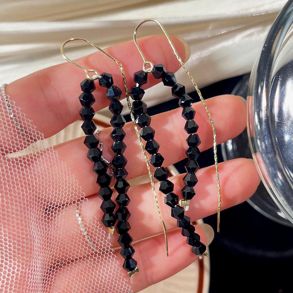 Cat's Eye Tassel Ear Chain 2024 Trend: Elegant Long Earrings with Light Luxury Design