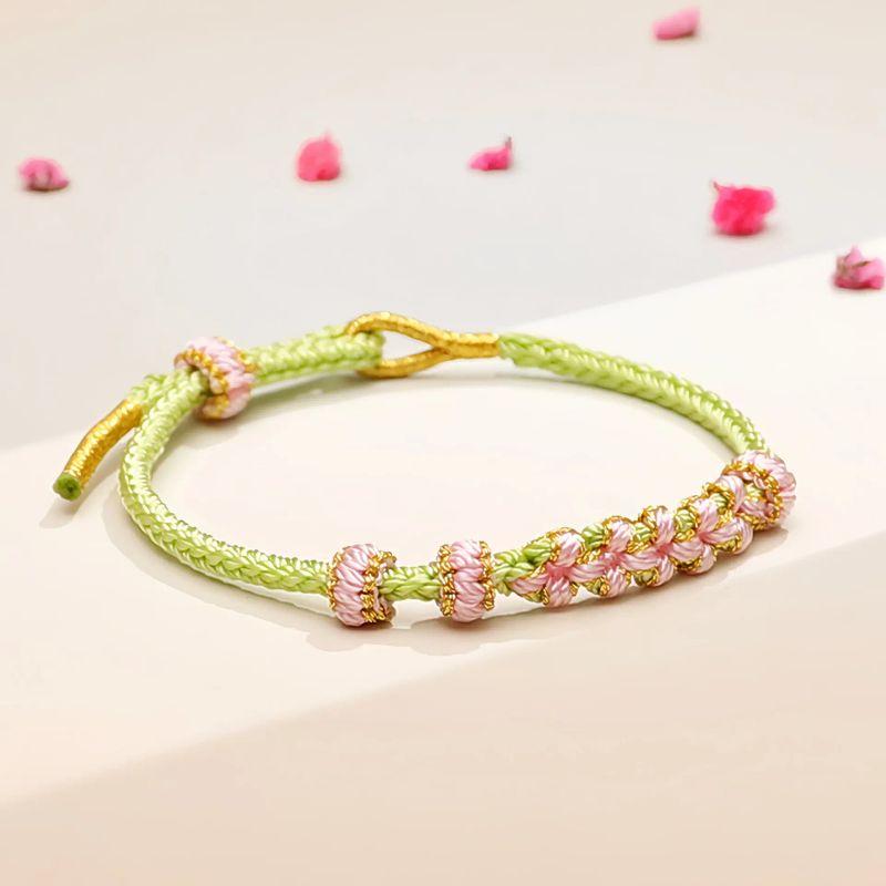 

Браслет «Узел цветка персика» Ручной работы Плетеный ремешок для переноски лилии Год животного Бисером Полуфабрикат Сделай сам Красная веревка Мужской и женский Light green peach blossom knot