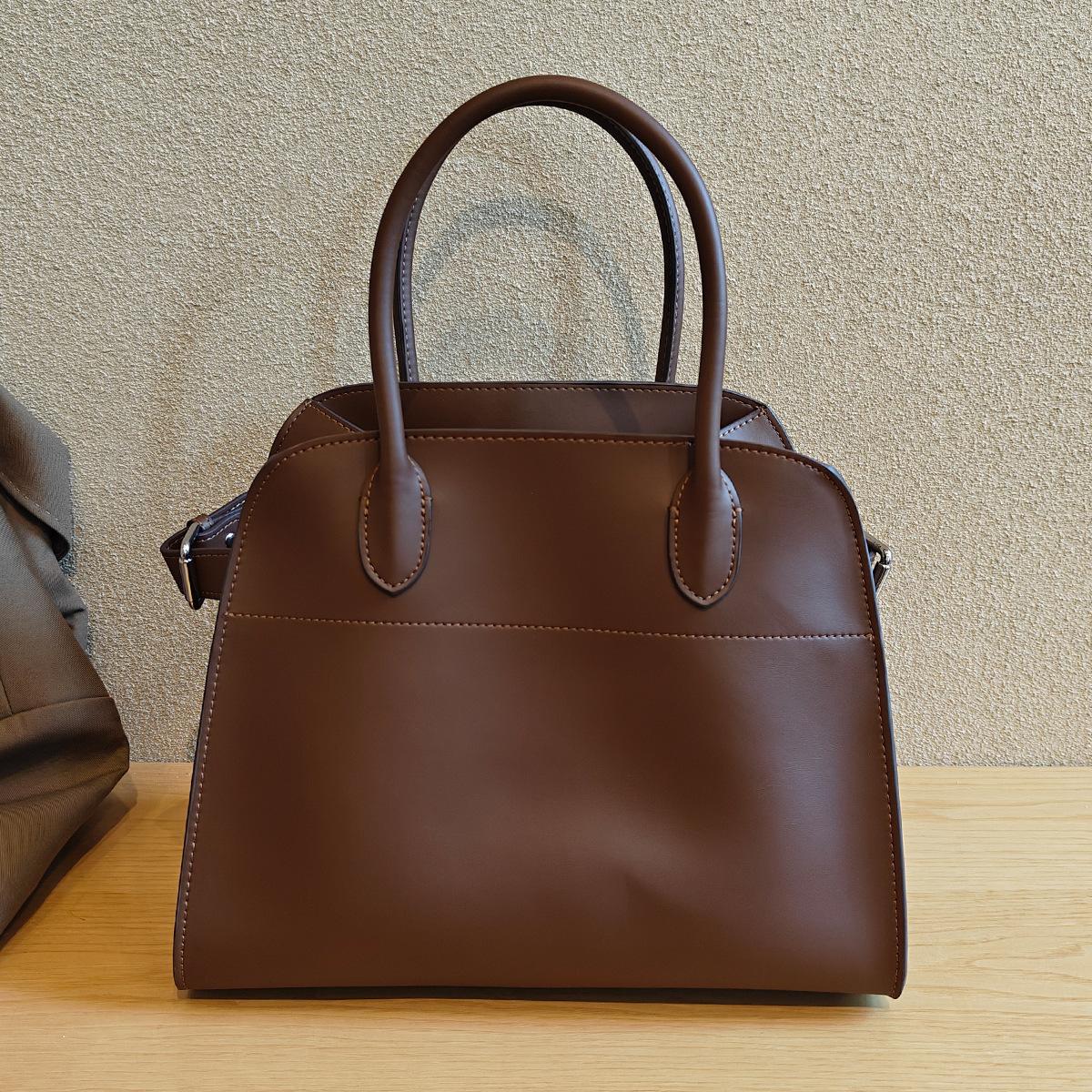 

Новый стиль Высококачественная сумка-тоут из натуральной кожи Модная минималистичная повседневная сумочка Большая вместимость Ретро широкий плечевой ремень Сумка на одно плечо для женщин Length 30x Width 19x Height 24cm кофейный