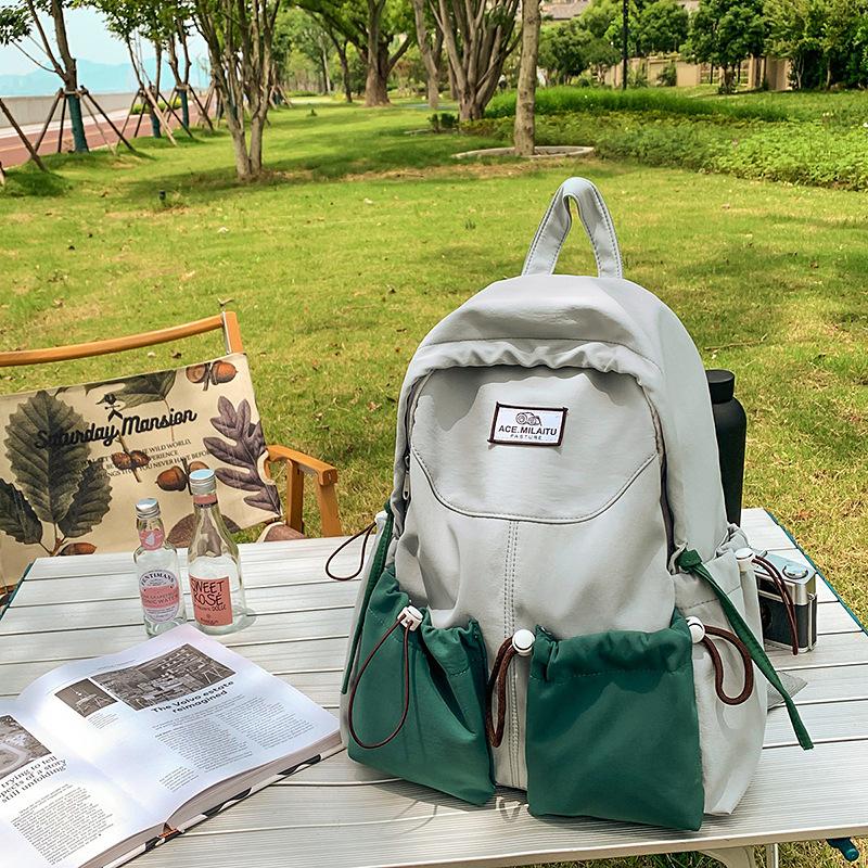 New high-value college-style men's and women's schoolbags, Korean version school students, contrasting colors, casual commuting, versatile backpack.