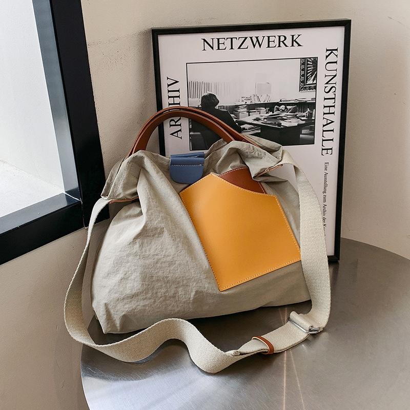 ins niche design splicing canvas bag Korean version women's shoulder bag commuter tote bag versatile casual messenger bag