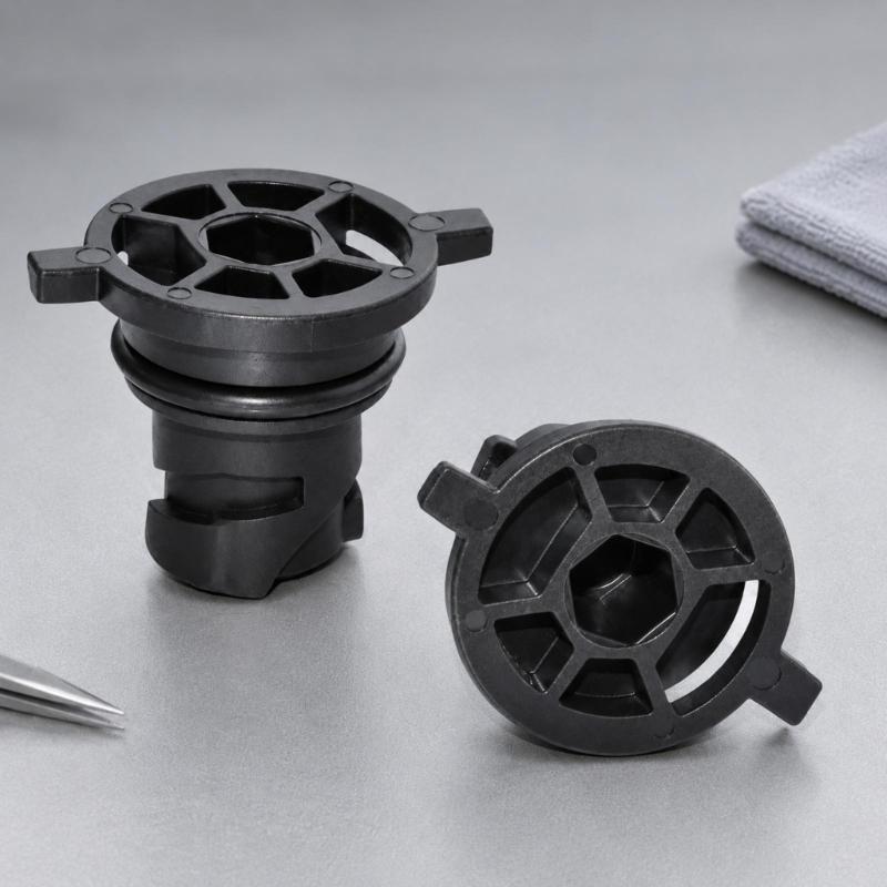 111116RC2B Black Automotive Oil Drain Closure with Two Opposing Grips, Recessed Center Drive, and Round Engineering Plastic Body