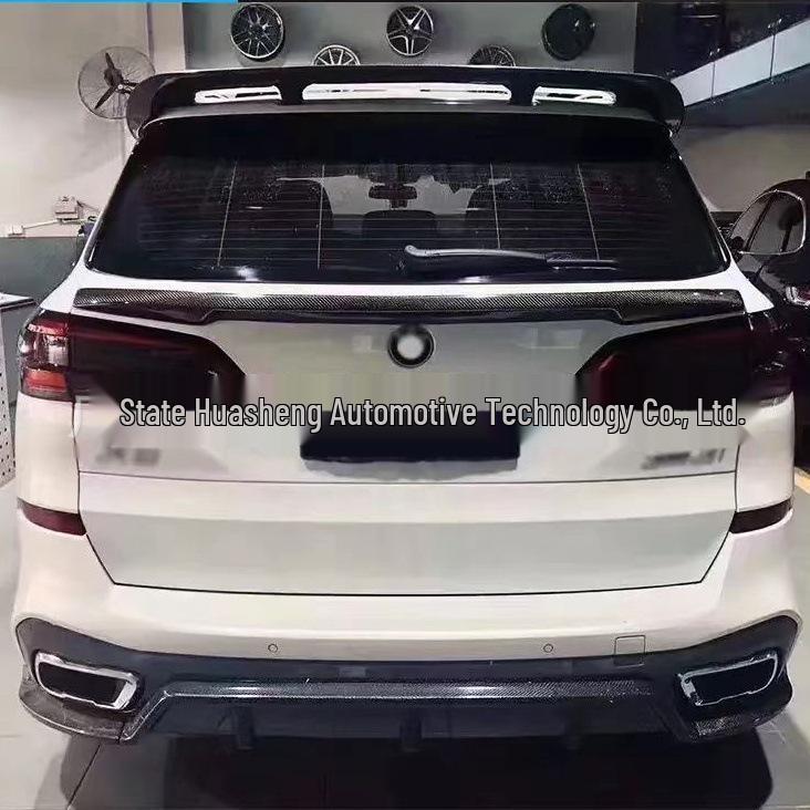 BMW X5 G05 Carbon Fiber Black Warrior Kit: Head Shovel, Front Lip, Side Skirts, Rear Wing, and Corner Spats.