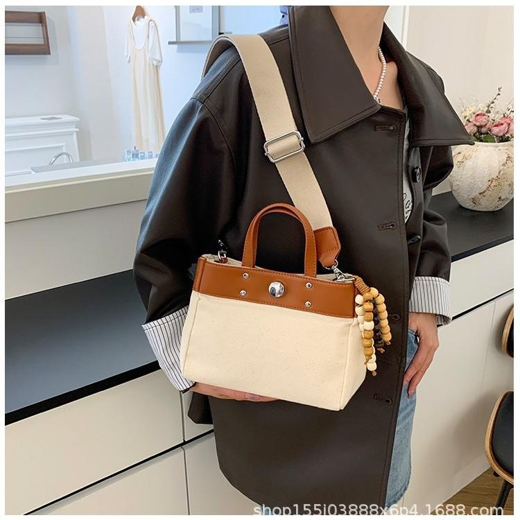 New niche design simple fashion canvas large capacity commuting wind tote bag casual texture hand