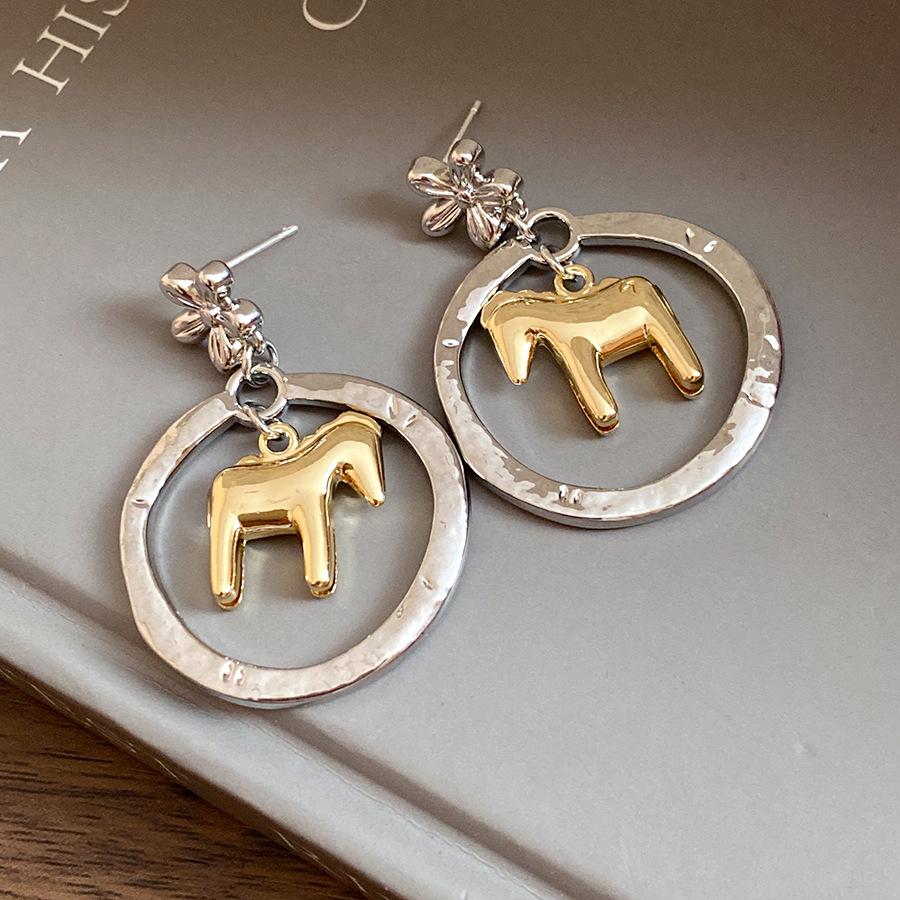

Silver needle metal round hollow pony pendant earrings European and American ins versatile earrings light luxury high-end earrings women