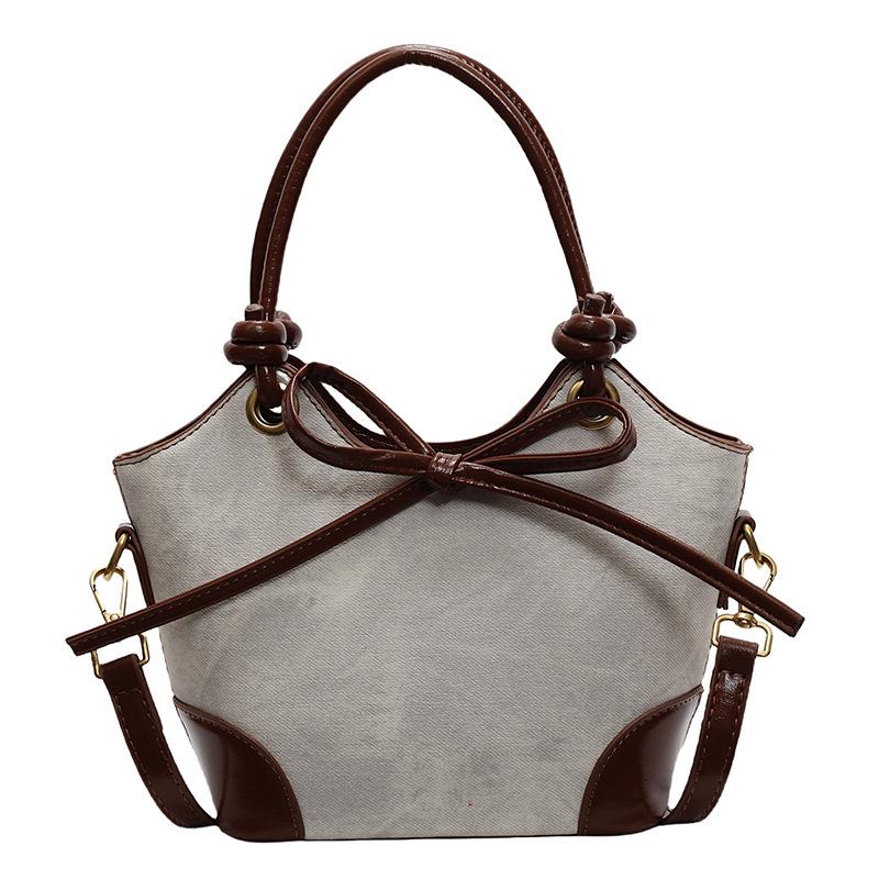 

2025 new Korean design contrasting color portable bucket bag casual women commuter style advanced messenger bag коричневый