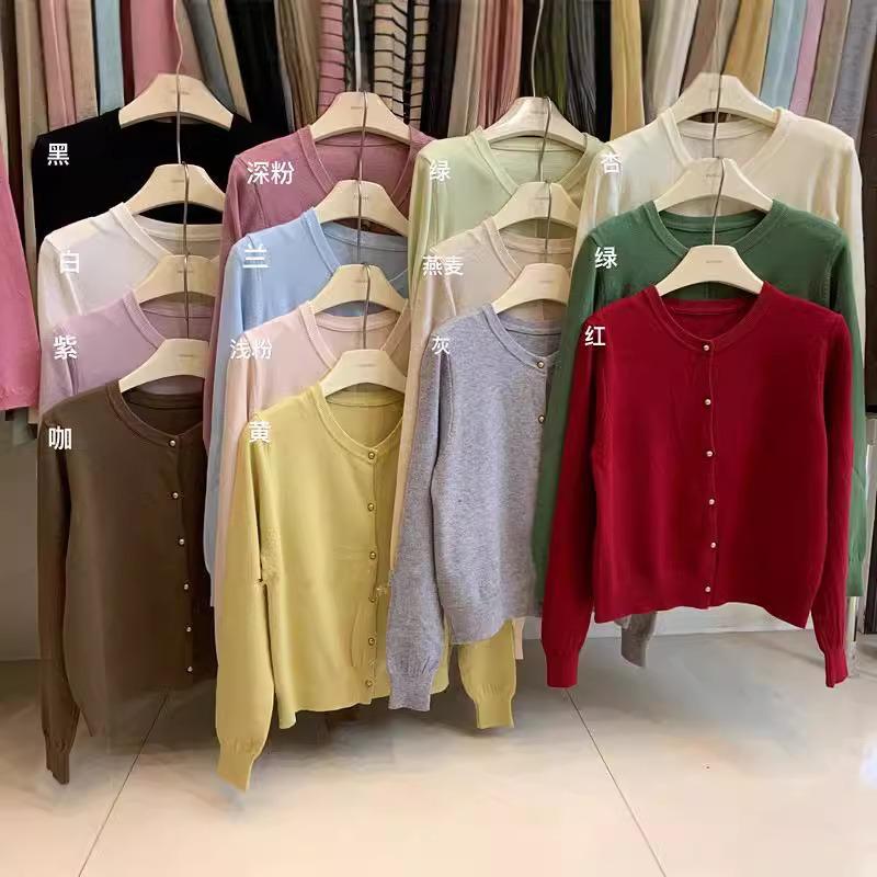 Solid color crew neck knitted cardigan women's spring and autumn new design sense long sleeve sweater jacket top trendy