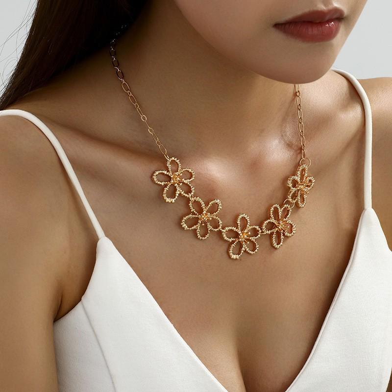 Retro Metal Hollow Flower Jewelry Set: Necklace, Bracelet, Earrings & Ring for Elegant Women
