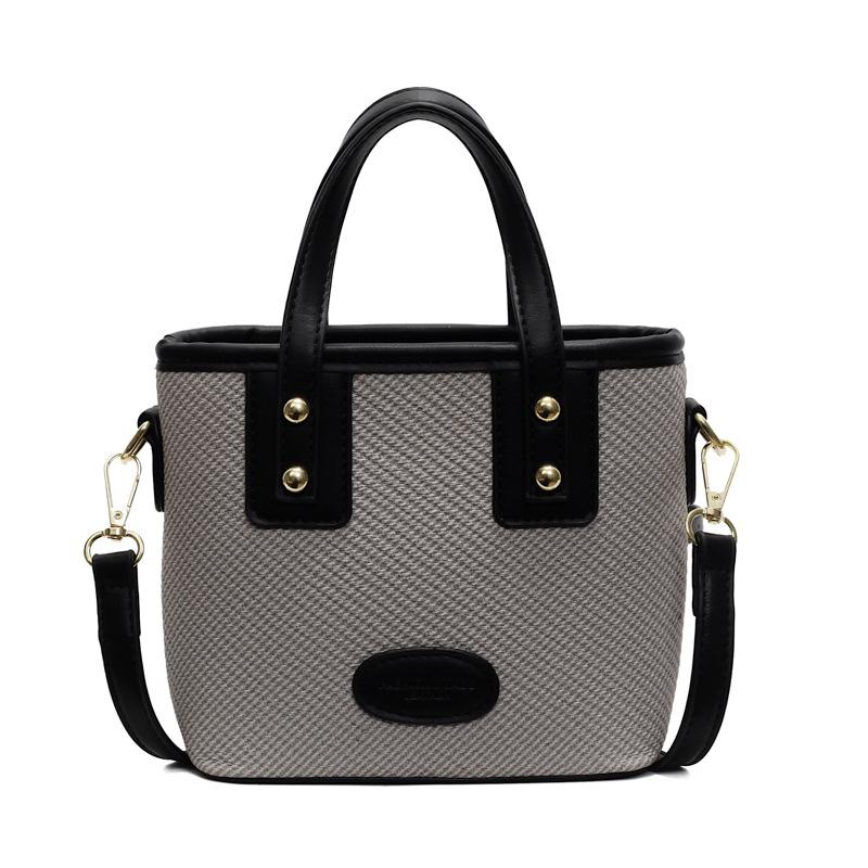 Spring new Korean version casual contrasting color fashionable portable bucket bag women's commuting versatile simple shoulder messenger bag