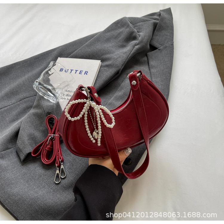 

This year, the popular bow underarm bag 2025 new Korean version niche croissant bag fashion commuter shoulder messenger bag бордовий