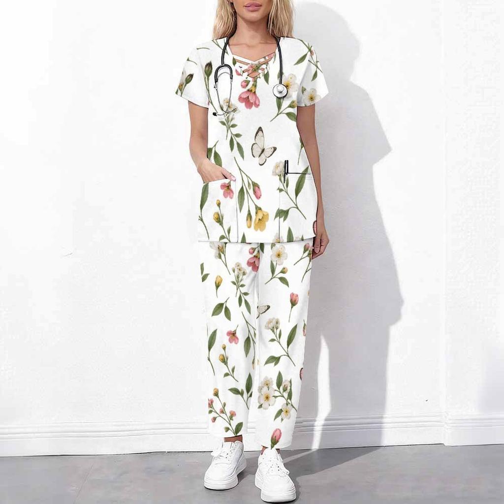 Women Plus Size White Floral Printed Scrub Set Cutout Neck Short Sleeve Pocket Top Long Pants