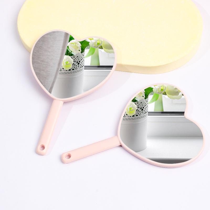 

Portable Mini Heart-Shaped Handheld Mirror with Handle and Logo Customization Option Mini Heart Mirror 8*12cm рожевий