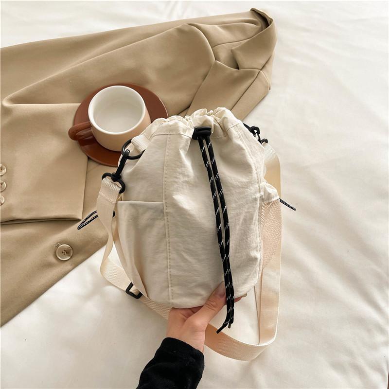 Wersja koreańska nowej torby ze sznurkiem damski trend mody na jedno ramię crossbody torba typu bucket na wyjścia casualowa przenośna torba na telefon