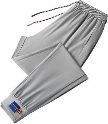 Aspersio Cool Casual Rebrované Letné Dlhé Nohavice pre Mužov a Ľahké Elastické Strečové Džersejové Dlhé Relaxačné Tepláky Šedé, Pohodlné, Ľahké, Manžety,