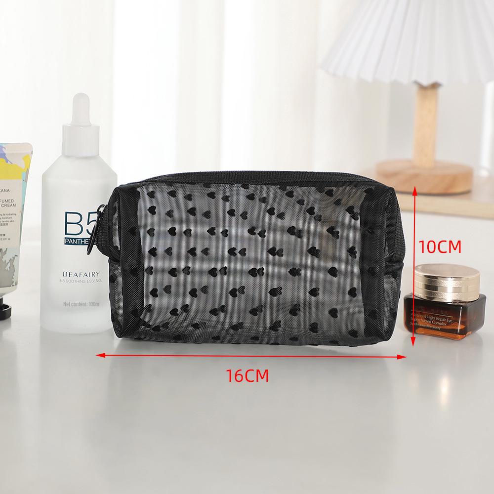 Přenosná kosmetická taška přes hranice s designem ve stylu rtěnky a zapínáním na zip