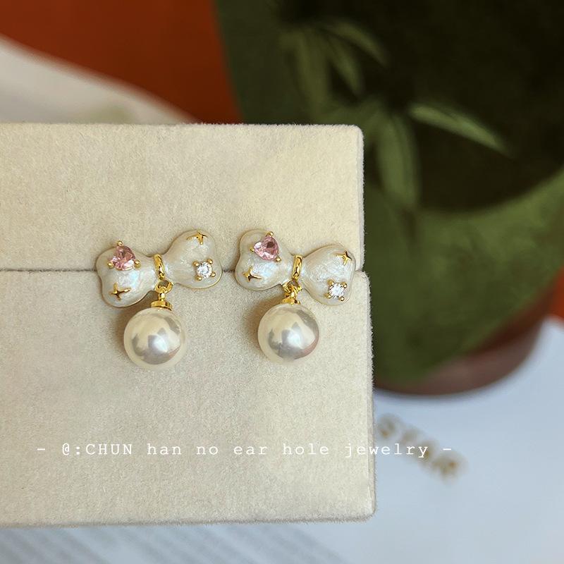 

Color bow pearl ear clips niche unique high-end stud earrings fashion spring and summer earrings without ear piercings