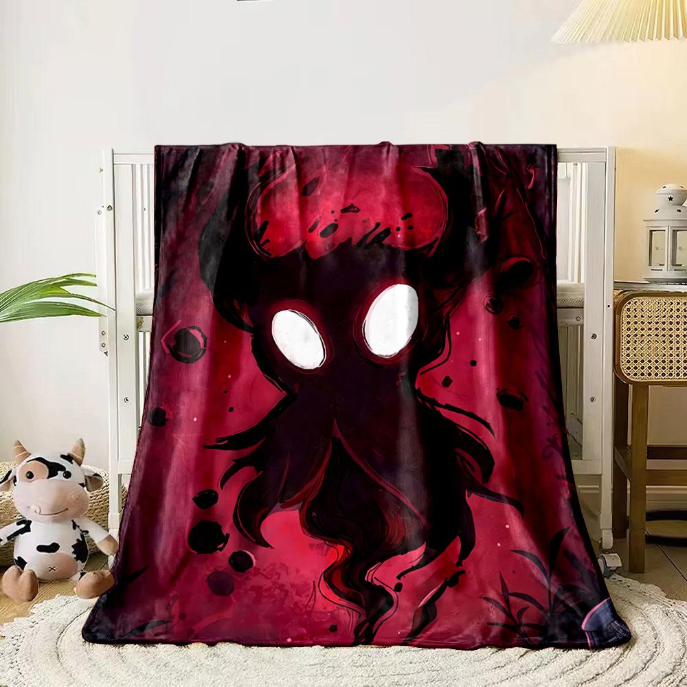 A dark, shadowy figure with glowing white eyes against a red background. for all seasons blanket lunch break throw gift 80cm x 120cm