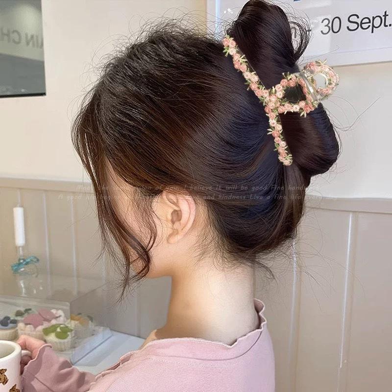 The Flower Hairpin Is Sweet and Ethereal. The Shark Hairpin Is Held At The Back of The Head