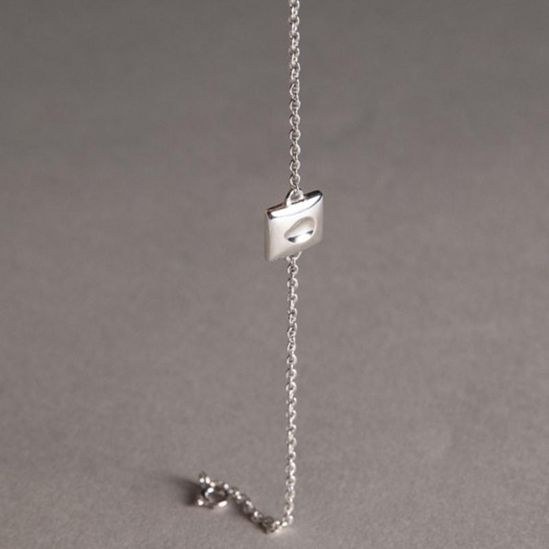 TRAGEZEICHNUNG Mini-Mango-Biss-Armband