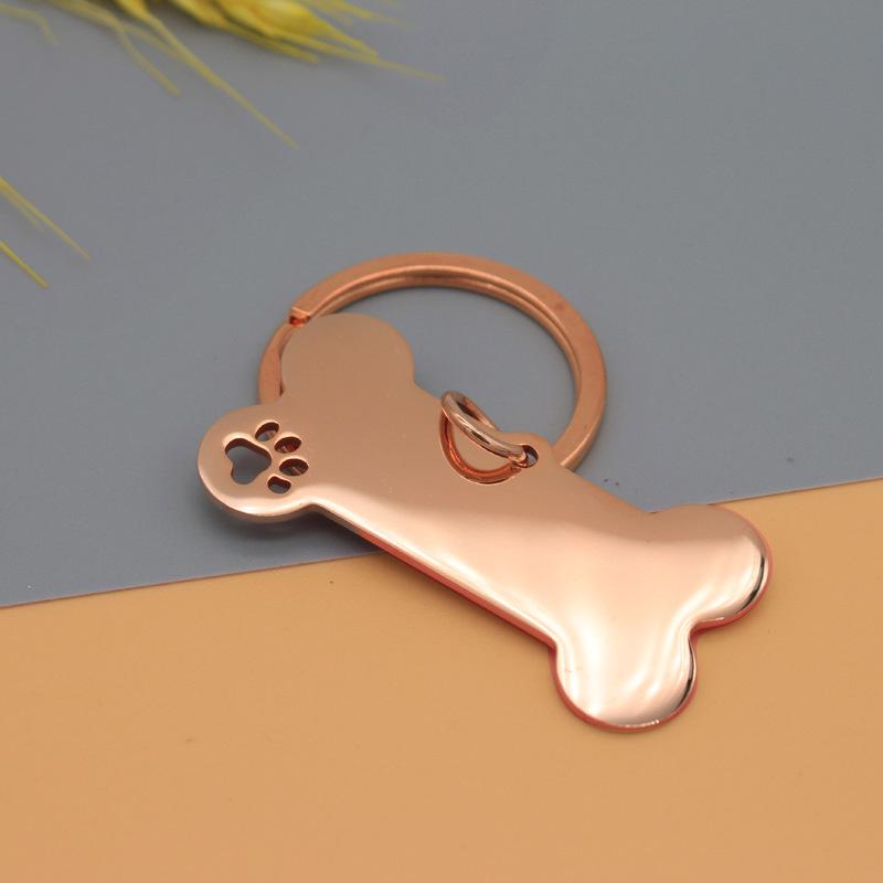 

Нержавіюча сталева жетон для собаки з лазерним гравіюванням відбитка лапи та кістки для ідентифікації домашнього улюбленця