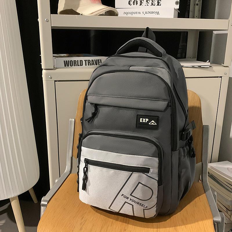 High value trendy cool letter backpack couple contrasting colors simple and lightweight travel mountaineering backpack
