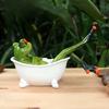 A Whimsical Frog Statue with a Unique Design of a Frog Taking a Bath Perfect for Home Decor Both Indoors And Outdoors