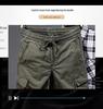 Men's Spring and Autumn Fashion Brand Casual Solid Color Overalls with Loose Cuffs.