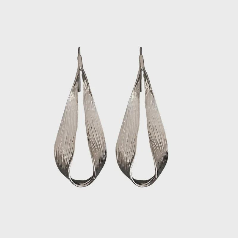 "Exquisite Metallic Leaf Drop Earrings: European & American Style, Trendy and Unique Design for Women."