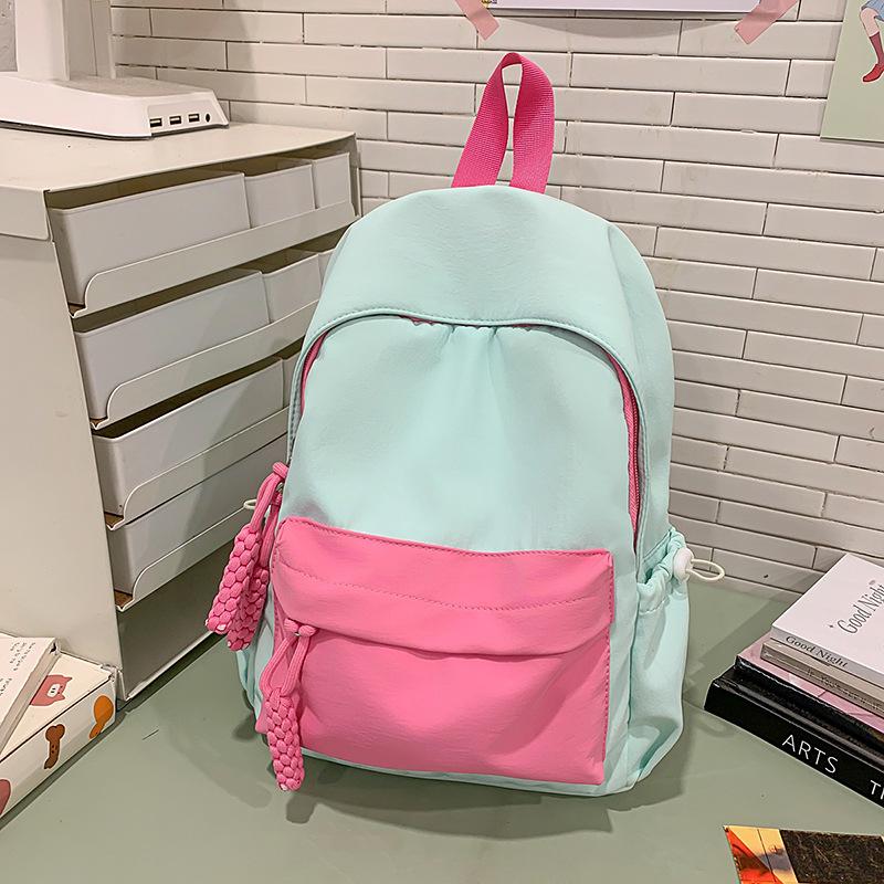 

Новый высокоценный дофаминовый макаронный цвет повседневный и простой легкий рюкзак для учеников средней школы