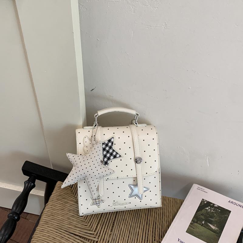 

Korean star polka dot backpack bag women s new spring multi-function niche non-collision commuter messenger bag single pack белый