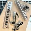 A Ruler for Music Enthusiasts, a Piano Keyboard, And a Tool for Measuring Musical Staff