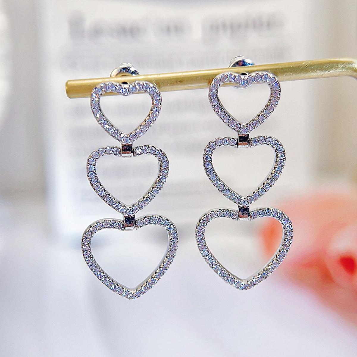 

Высококачественные золотые или серебристые длинные висячие серьги с кубическим цирконием в форме сердца, легко сочетающиеся ювелирные изделия ко Дню святого Валентина серебряный