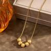 Women's Korean Style Lucky Bead Titanium Steel Necklace - Elegant Gold Bean Beads with Carved Surface Clavicle Chain Jewelry.