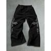 Trendy Black Loose Fit Sweatpants for Men, Wide Leg with White Abstract Flame Prints, Drawstring, Casual Street Style