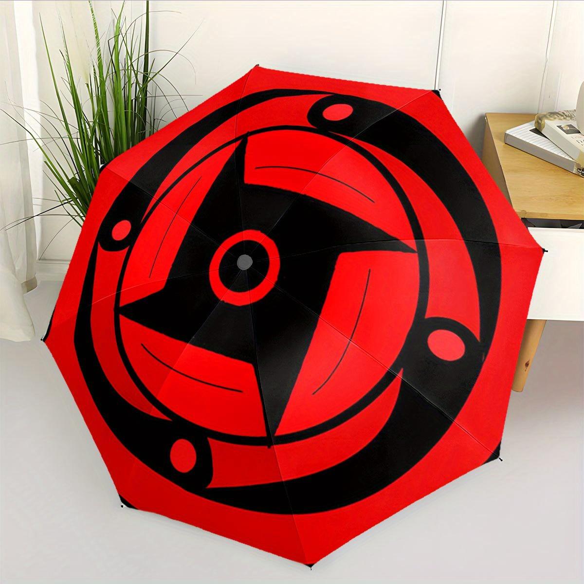 A Red And Black Automatic Folding Umbrella Featuring a Design Inspired by Sharingan. It S a Portable And Collapsible Accessory