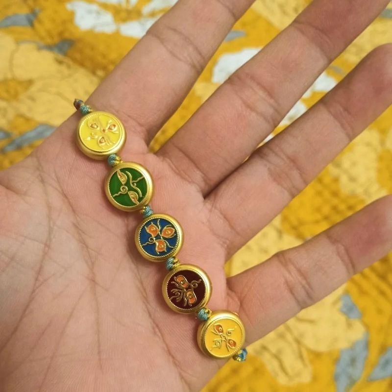 

on Douyin Li Huofang Tibetan Style Carrying Strap Double Ring New Chinese Style Mountain Ghost Flower Coin Bell Bracelet Copper Coin Same Style Chain Four-strand (colorful rope) hand rope