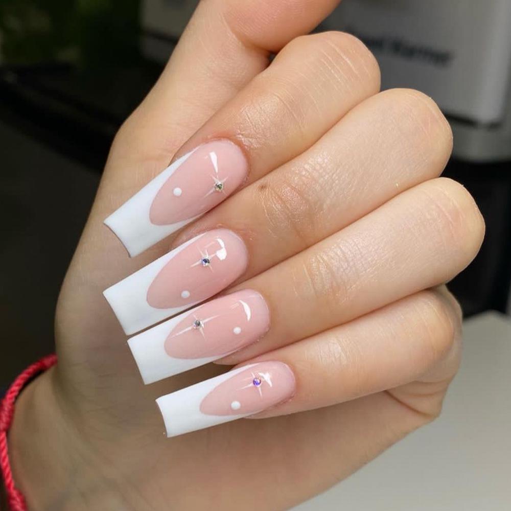 

Pink Stiletto Nail Tips with White French Edge & Rhinestone Starbursts